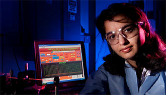 Harshini Mukundan with the optical biosensor 